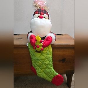 Vintage Santa Claus Stocking Holding a Christmas Tree